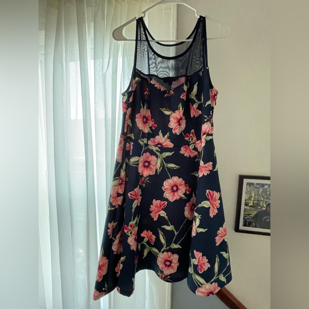 Navy blue cocktail dress with illusion neckline.